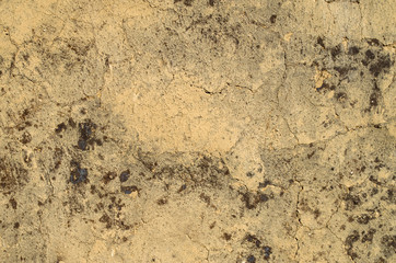 Old wall plastered with mud closeup