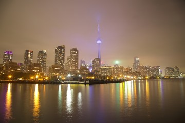 Fototapeta na wymiar Toronto Skyline at night with a reflection in Lake Ontario