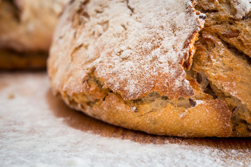 Bread and flour on the wooden table