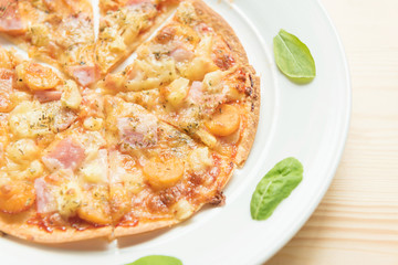 Rustic pizza on wooden background. Top view