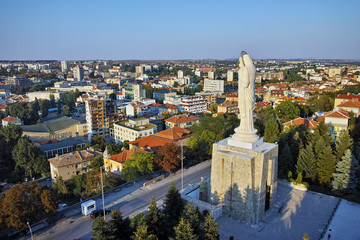 Fototapeta premium Monument of Virgin Mary and panorama towards City of Haskovo, Bulgaria