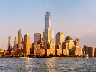Fototapeta na wymiar The skyline of Lower Manhattan at sunset in New York