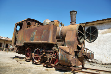 Fototapeta na wymiar Derelict and rusting steam train in Humberstone, Chile