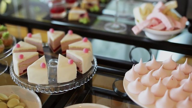 Various pieces of cake on a table