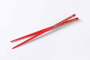 Red chopsticks with flower pattern