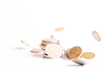 Euro money. Coins are isolated on a white background. Currency of Europe. coins fall down. Levitation and balance of money