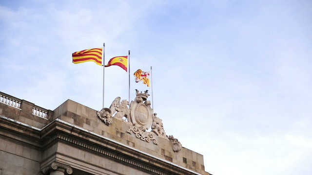Waving flags of Spain and Catalonia