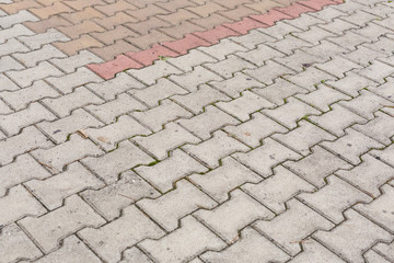 Red brick paving stones on a sidewalk