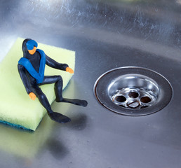 small diver sitting in the kitchen sink 