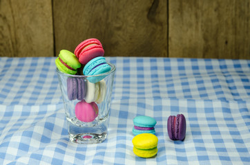 colorful macaroons on checkered tablecloth