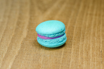 different kinds of macaroon placed on a wooden table