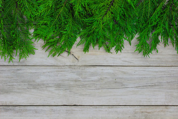 Christmas tree garland border on wood background