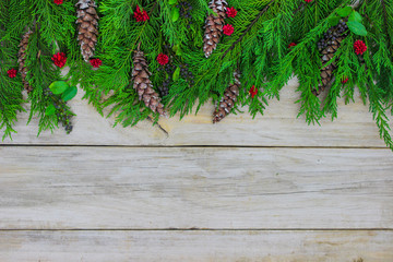 Christmas tree garland border on wood background