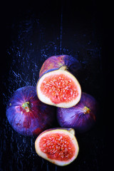 figs on a dark wooden background old retro vintage style selective soft focus