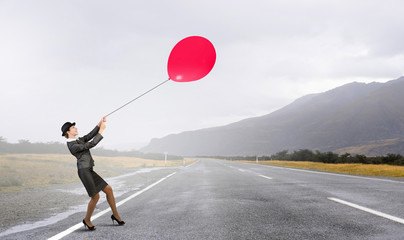 Woman fly on balloon