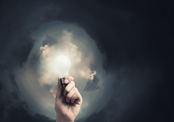 Glowing electric bulb . Concept image