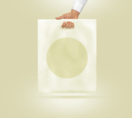 Blank plastic bag mock up holding in hand. Empty polyethylene pack isolated.