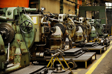Fototapeta premium Detail with machinery inside old factory