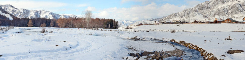Mountain village winter brook