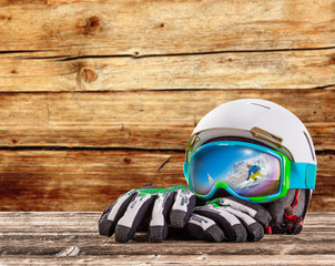 Colorful ski glasses, gloves and helmet