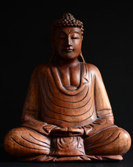 Buddha portrait against dark background