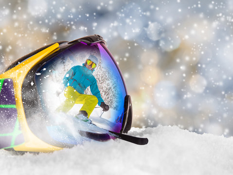 Colorful ski glasses with skier 