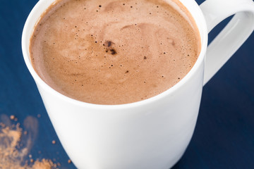 White mug with hot chocolate.