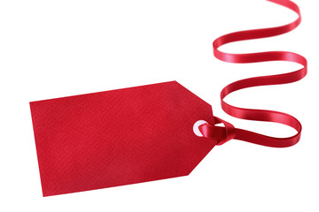 Blank red gift tag with curly ribbon isolated on white background