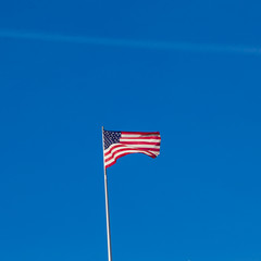  the American flag on top of the US Embassy in Berlin.