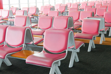 Fototapeta premium row of pink leather chair at the airport