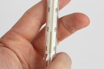 thermometer in hand closeup