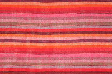 Striped colorful shawl as background texture
