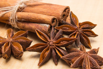 Cinnamon sticks and anise on wooden table, seasoning for cooking