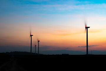 Fototapeta na wymiar Sunset above the windmills