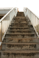 Old stairs of the overpass in the city