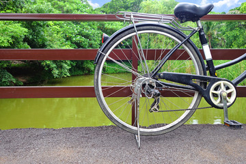 Fototapeta na wymiar Bicycle Wheel with beautiful nature background