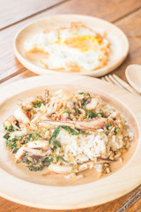 Rice topped with stir-fried squid basil and fried egg (Thai food