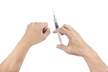 Hand holding a syringe