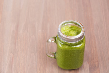 A green smoothie in a mason jar