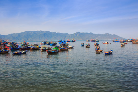 large group of Vietnamese fishing boats in azure sea