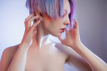 Fototapeta premium young girl with pink eyes and hair, like a doll