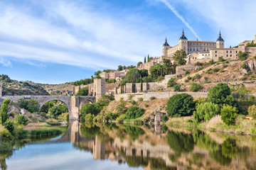 Puente de Alcantara and Alcazar de Toledo - obrazy, fototapety, plakaty
