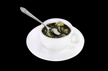 Thai money coins in a coffee cup