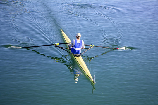 Young man Rower in a boat