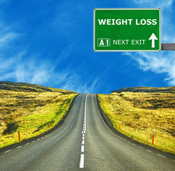 WEIGHT LOSS road sign against clear blue sky