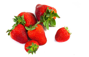 big red juicy rich strawberries with pedicle on white backgrond
