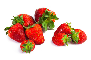 big red juicy rich strawberries with pedicle on white backgrond
