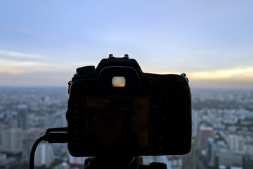 dslr camera with bangkok cityscape © siiixth