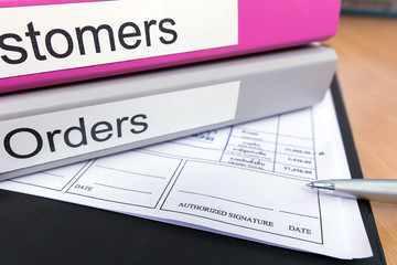 Signature field on document with pen and file