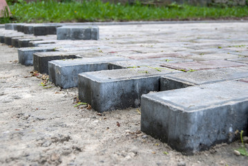 Installing paver bricks for the sidewalk pavement
